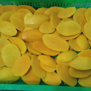 Frozen mango half cut